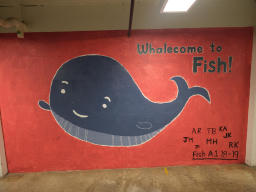 Depicts a whale waving, with text saying 